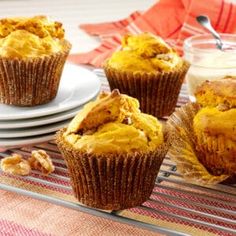 three muffins sitting on top of a cooling rack