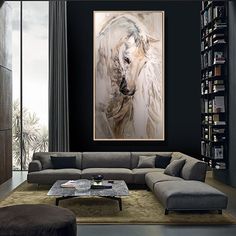 a living room filled with furniture and a large painting on the wall above it's head