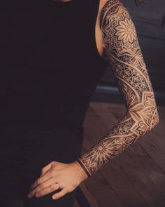 a man with a tattoo on his arm