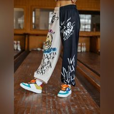 Length: 40.7” Waist Size: 29.1-42.5” Hip Size: 46.9” Thigh: 26.9” Multicolor Patterns Type: Graphic And Colorblock Type: Jogger Length: Long Regular Fit Elastic Waist Closure 95% Polyester 5% Elastane Baggy Multicolor Bottoms For Streetwear, Multicolor Wide Leg Streetwear Bottoms, Trendy Patchwork Bottoms For Streetwear, Multicolor Wide Leg Bottoms For Streetwear, Multicolor Casual Streetwear Bottoms, Multicolor Straight Leg Bottoms For Streetwear, Hip Hop Wide Leg Bottoms With Graphic Print, Multicolor Straight Leg Pants For Streetwear, Casual Multicolor Color Block Bottoms