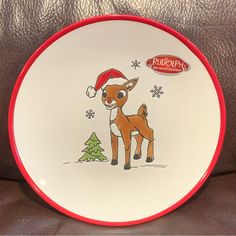 a christmas plate with a cartoon deer on it