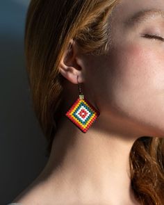 Infuse your style with a burst of color and texture with our Prism Weave Earrings. These vibrant earrings showcase a mesmerizing blend of woven cotton in a spectrum of hues, creating a captivating prism effect that catches the light with every movement. Lightweight and comfortable, these dangle earrings are perfect for adding a playful touch to your everyday outfits or making a bold statement on special occasions. By wearing the Prism Weave Earrings, you not only embrace a unique and eye-catchin Multicolor Handwoven Earrings, Balochi Embroidery, Earrings Handmade Boho, Woven Earrings, Boho Mode, Earrings Colorful, Earrings Unique, Handcrafted Earrings, Bracelet Collection