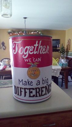 a large red and white can sitting on top of a counter