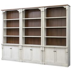 an old white bookcase with wooden shelves