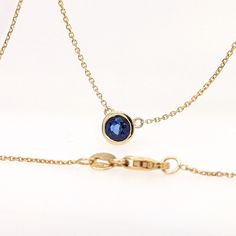 Elevate your style with our Solitaire Natural Sapphire Necklace. Featuring a round cut 6mm blue sapphire bezel set pendant on a solid 14k gold chain, this minimalist piece is perfect for everyday wear. September birthstone adds a personal touch. Designer Silver Jewellery, Jewelry Showcases, September Birthstone, Sapphire Necklace, Earring Findings, Natural Sapphire, Pendant Bracelet, Estate Jewelry, Gold Chains