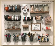 the peg board is organized with craft supplies