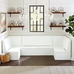 a room with white walls and wooden shelves