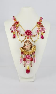 Absolutely Frivolous Pink Cherub Art Nouveau Hand Painted & Gilded Necklace, 24ct Gold Plated with Vintage Czech Drops, Lampwork, Vintage Swarovski Beads, Claw Set Rhinestones and extender chain. We're winging it, that's what Angels do!  Let your soul sparkle and your heart flutter like the wings of an Angel with this truly magical and incredibly unique one of a kind necklace. Cherub Necklace, Wings Of An Angel, Cherub Art, Unique Ornaments, Resin Jewelry Diy, Heart Flutter, Angel Jewelry, Necklace Art, Swarovski Beads