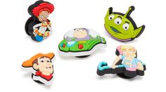 six cartoon character magnets in various shapes and sizes