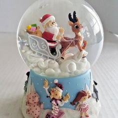 there is a snow globe with some toys in it