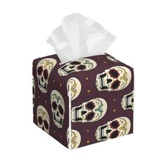 a tissue box with skulls on it