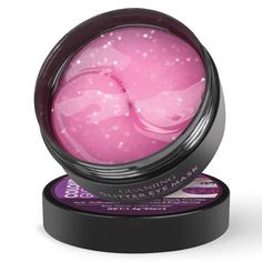 a pink ball with stars on it in a black container and its lid is open