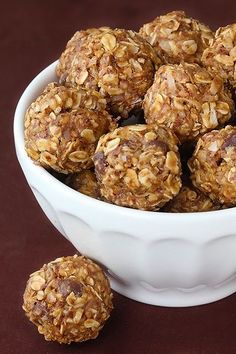 a bowl filled with no bake energy bites on top of a table