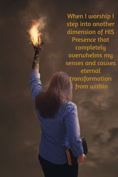 a woman holding her hand up to the sky with fire coming out of it and bible verse written below