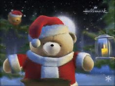 a teddy bear wearing a santa hat and holding a lantern in front of a christmas tree