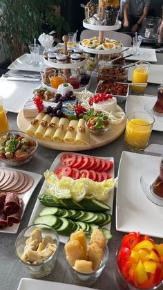 an assortment of food is displayed on the table