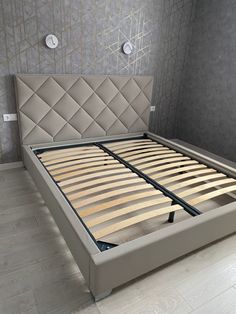 the bed frame is made up and ready to be used as a headboard or foot board