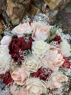 a bridal bouquet with red and white flowers