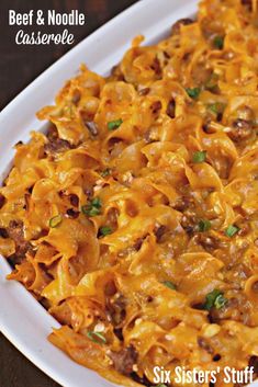 a casserole dish with beef and noodle in it on a white plate