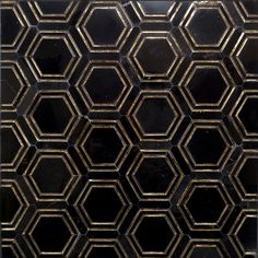 an abstract black and gold pattern with hexagonal tiles on it's sides