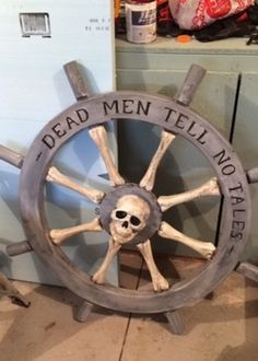 a wooden wheel with a skull on it and the words dead men tell no tales