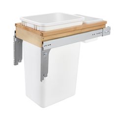 a white trash can with a wooden lid on it's side and two plastic bins attached to the top