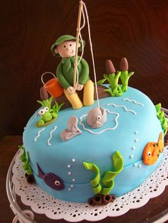 a birthday cake decorated with an image of a fisherman