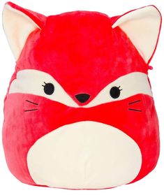 a red and white stuffed animal with black eyes