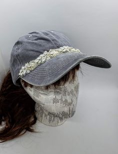 This is a new product from Handmade MKE! This is a distressed gray one size fits all baseball cap with a hole for your ponytail in the back, it is also adjustable. On the front of the hat is band of clear rhinestones, marquise opal stones, sequins and beads. On the brim of the hat are three more opals and a single circular rhinestone. This is very comfortable, and great to throw on with a plain white T-shirt! Like our Facebook Page and get 10% off when you message me before checkout! Everything Adjustable Rhinestone Baseball Cap With Curved Brim, Adjustable Gray Visor Fitted Hat, Gray Adjustable Baseball Cap, Adjustable Rhinestone Cap, Adjustable Silver Snapback Baseball Cap, Silver Adjustable Snapback Baseball Cap, Gray Brimmed Baseball Cap, One Size Fits Most, Adjustable Silver Baseball Cap, Silver Adjustable Baseball Cap