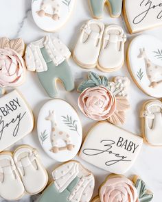 baby shower cookies are laid out on a table