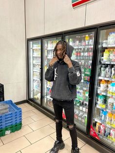 a person standing in front of a refrigerator