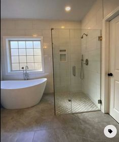 a bathroom with a tub, shower and sink