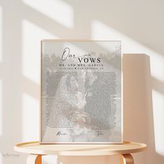 a poster on a table in front of a white wall with the words vows written below it