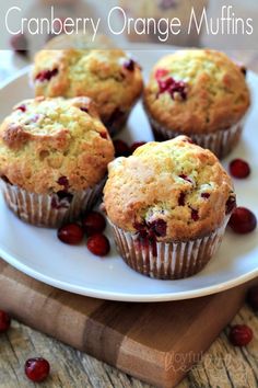 cranberry orange muffins on a white plate