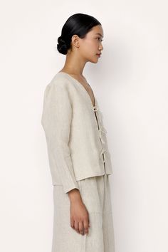 Introducing our Tie Front Blouse, a sophisticated sustainable staple for any wardrobe Crafted from organic linen, this shirt exudes effortless style. Pair it effortlessly with our Everyday Pant for a laid-back look. Made with organic Linen Lined with organic cotton Handmade in India Machine wash cold, lay flat to dry, warm iron as needed. Honoring Earth + Maker Our wovens are handcrafted in India, preserving age-old textile traditions. Made in beautiful, family-operated studios under safe workin Spring Linen Blouse For Day Out, Spring Flax Colored Ramie Blouse, Spring Flax Ramie Blouse, Spring Flax-colored Ramie Blouse, Spring Flax Relaxed Fit Blouse, Spring Linen Blouse In Flax Color, Relaxed Linen Tops For Daywear, Effortless Linen Tops For Spring, Spring Eco-conscious Relaxed Fit Tops