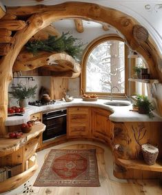 a kitchen with an arched window and wooden cabinets