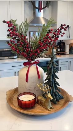 a christmas centerpiece with candles and decorations