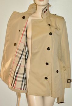 AUTHENTIC BURBERRY KENSINGTON DOUBLE BREASTED COTTON TRENCH COAT Color: Honey Retail: $2090 New with tags Made in England                                                                                                                                                         Women's size: US 16 EU 50                      Measurements: underarm to underarm (bust) - 21" shoulder to shoulder - 17.5" inside arm length - 19" length, straight down center of back - 33".5 (measurements taken outside of garment when garment is lying flat unstretched; please measure similar garment for comparison) Notch lapel Long sleeves Double-breasted button front with hook & eye closure Button epaulets Adjustable buckle cuffs Buckle belt Waist button pockets Back storm shield Back vent   SHIPPING I ship Domest Trench Coat Street Style, Cotton Trench Coat, Lightweight Trench Coat, Burberry Coat, Autumn Fits, Double Breasted Trench Coat, Double Breasted Coat, Trench Coats Women, Blazer Fashion