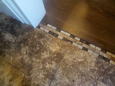 a tile floor that has been cleaned and is next to a door