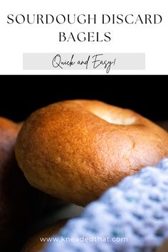 a close up of bread on top of a table with the words sourdough discard bagels