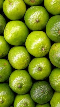 a pile of limes sitting next to each other