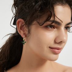 Look your luckiest in these delicate Lucky Clover Hoops Earrings. Crafted with a dainty clover and emerald, they add a pop of color and sparkle to your everyday look. Plated in 18K gold, these small but stylish earrings make sure you always look your luckiest. To keep your jewellery in the best condition, we recommend giving it a good care over time. By using a soft, lint-free jewellery cloth, you can remove blemishes that result from body oils, perfumes and lotions. Also remember try not to exp Dainty Green Flower Earrings With Ear Wire, Green Dainty Flower Drop Earrings, Green Dainty Drop Flower Earrings, Dainty Green Drop Flower Earrings, Dainty Green Dangle Flower Earrings, Dainty Green Flower Earrings, Elegant Green Earrings With Flower Charm, Everyday Green 14k Gold Earrings, Luxury Small Hoop Green Earrings