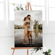 an easel with a wedding photo on it