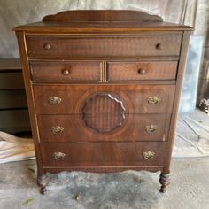 an old wooden dresser sitting in a room