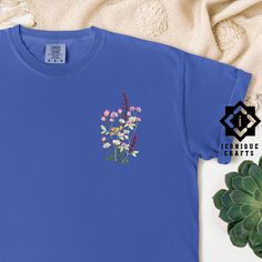 Comfort Colors Flower Embroidered Shirt, Floral Tee, Floral Sweatshirt, Flower T-shirt, Wild Flower sweatshirt, Wildflower Tee, Gift for her This listing is for an embroidered shirt, making it a luxurious choice. Embroidery adds a premium, tactile quality to your item, offering a more refined and durable finish compared to other methods. Explore more fun and unique designs at https://www.etsy.com/shop/iconiquecrafts/ SHIPPING TO HAWAII OR ALASKA Please contact us before ordering if you live in A Relaxed Fit Crew Neck Tops With Floral Embroidery, Relaxed Fit Floral Embroidery Tops With Crew Neck, Relaxed Fit Floral Embroidered Crew Neck Tops, Spring Long Sleeve T-shirt With Embroidered Graphics, Cotton Shirt With Floral Embroidery And Relaxed Fit, Blue Tops With Custom Embroidery For Spring, Blue Crew Neck Top With Custom Embroidery, Blue Cotton Shirt With Floral Embroidery, Relaxed Fit Cotton Top With Machine Embroidery