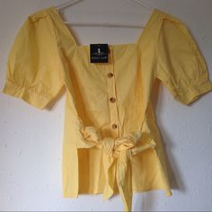 Brand New With Tag Nwt Zoozy Shop Yellow Waist Bow Tie Blouse Top Button Down Tee Shirt Bow Can Tie And It’s Adjustable As Shown In Pictures. One Size Fit All. Lady Like Shape Everybody Love Our Original Detail And Its Material. Tag For Love And Lemons Fl&L #4 Summer Brunch Shirt With Button Closure, Summer Brunch Shirt, Trendy Tops With Button Closure For Brunch, Summer Brunch Tops With Button Closure, Casual Blouse With Button Closure For Brunch, Yellow Blouse With Button Closure For Daywear, Day Out Buttoned Puff Sleeve Blouse, Trendy Button Tops For Brunch, Trendy Tops With Buttons For Brunch