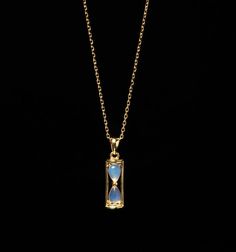 This elegant 15mm Hourglass necklace is presented with a minimalist design, classy and elegant, on a 1.0mm 18K gold plated Sterling silver chain. Hourglasses were an early dependable and accurate measure of time. The rate of flow of the sand is independent of the depth in the upper reservoir, and the instrument will not freeze in cold weather. From the 15th century onwards, hourglasses were being used in a range of applications at sea, in the church, in industry, and in cookery. This necklace br Large Charm Necklace, Fantasy Metal Necklaces For Collectors, Hourglass Jewelry, Hour Glass Necklace Pendants, Elegant Gold Jewelry, Hourglass Necklace, Interesting Necklace, Math Jewelry, Gold Steampunk Metal Necklaces