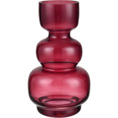 a red glass vase sitting on top of a table