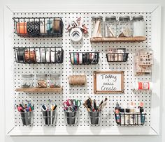 the peg board is organized with craft supplies