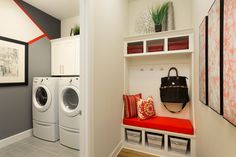 a white washer and dryer sitting next to each other in a laundry room